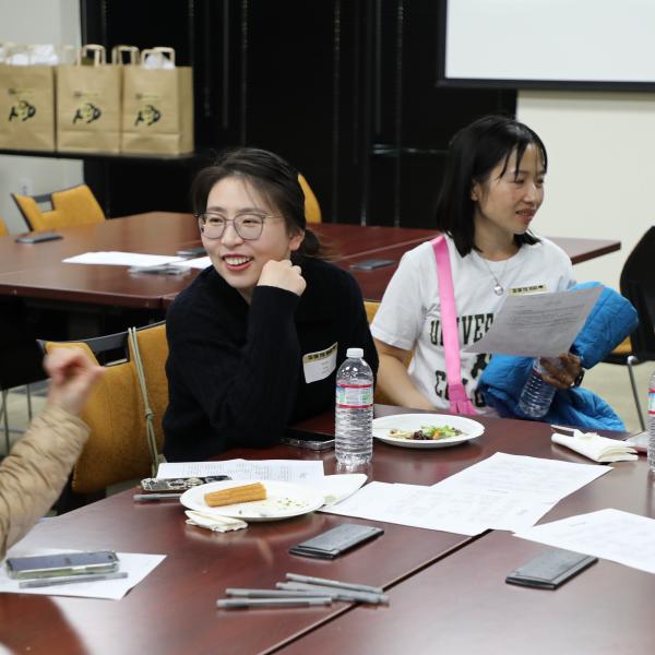 Group of people sitting in discussion