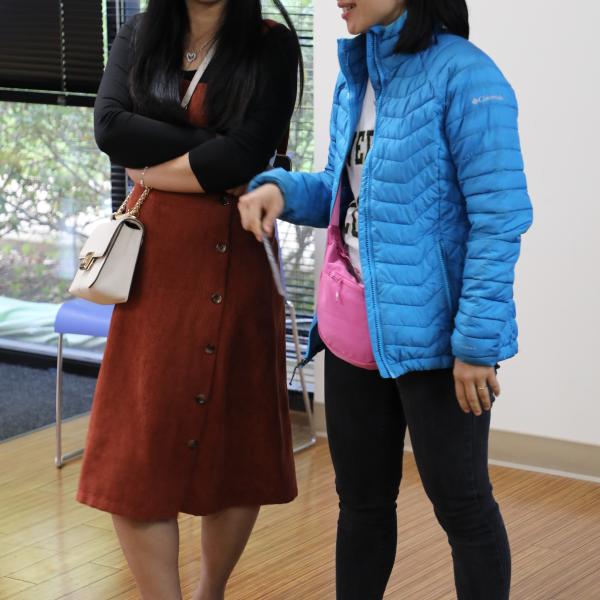 2 women standing next to eachother