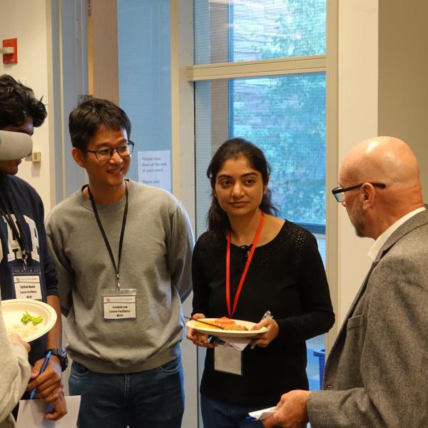Learners chatting with MS-CS Faculty Director Kevin Gifford