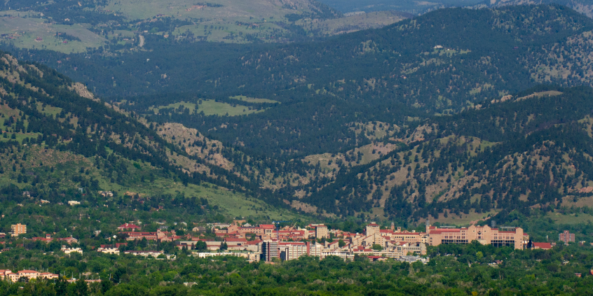 Cu Boulder campus surrounded by the flatiron mountains