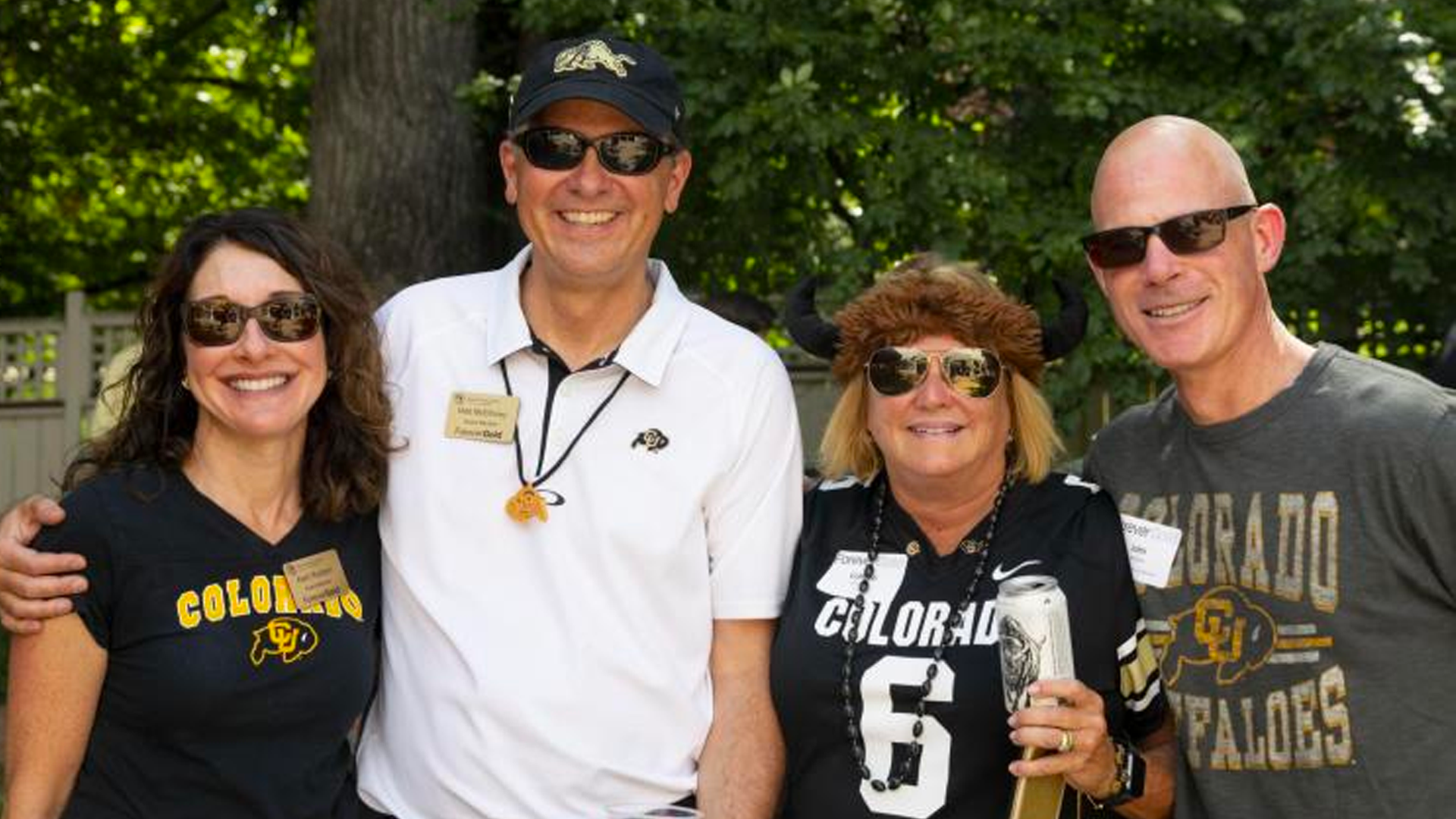 CU Boulder alumni fans connecting at a football game