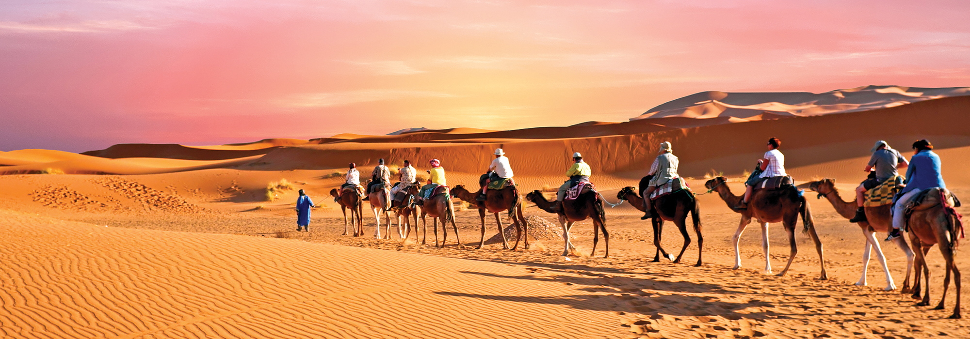 Travelers ride by camel during a trip to Morocco 