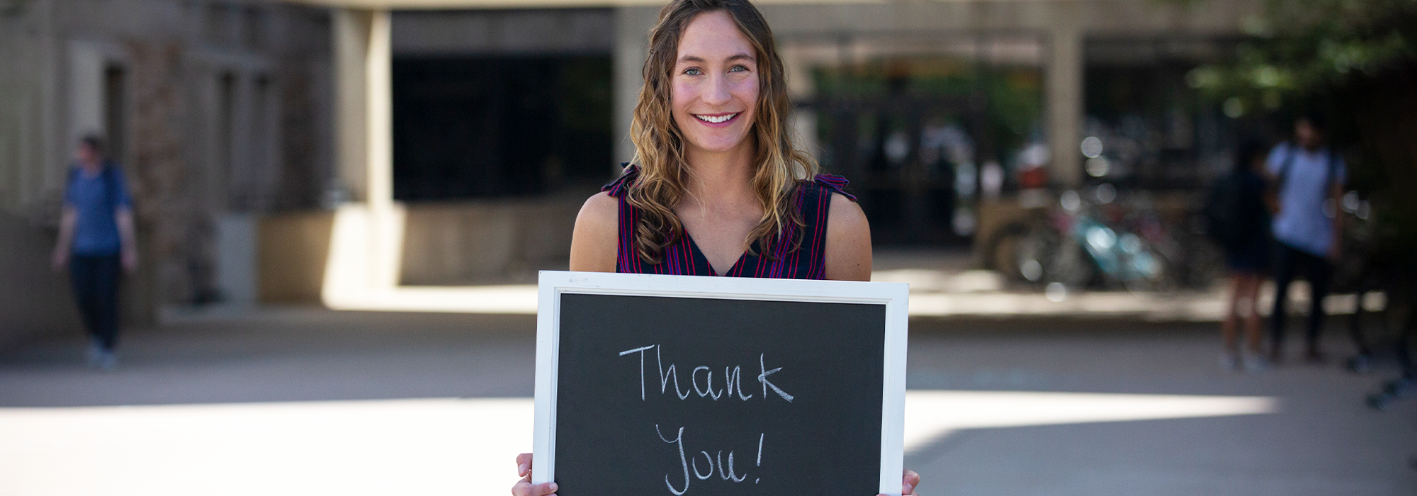 Smiling student saying thank you