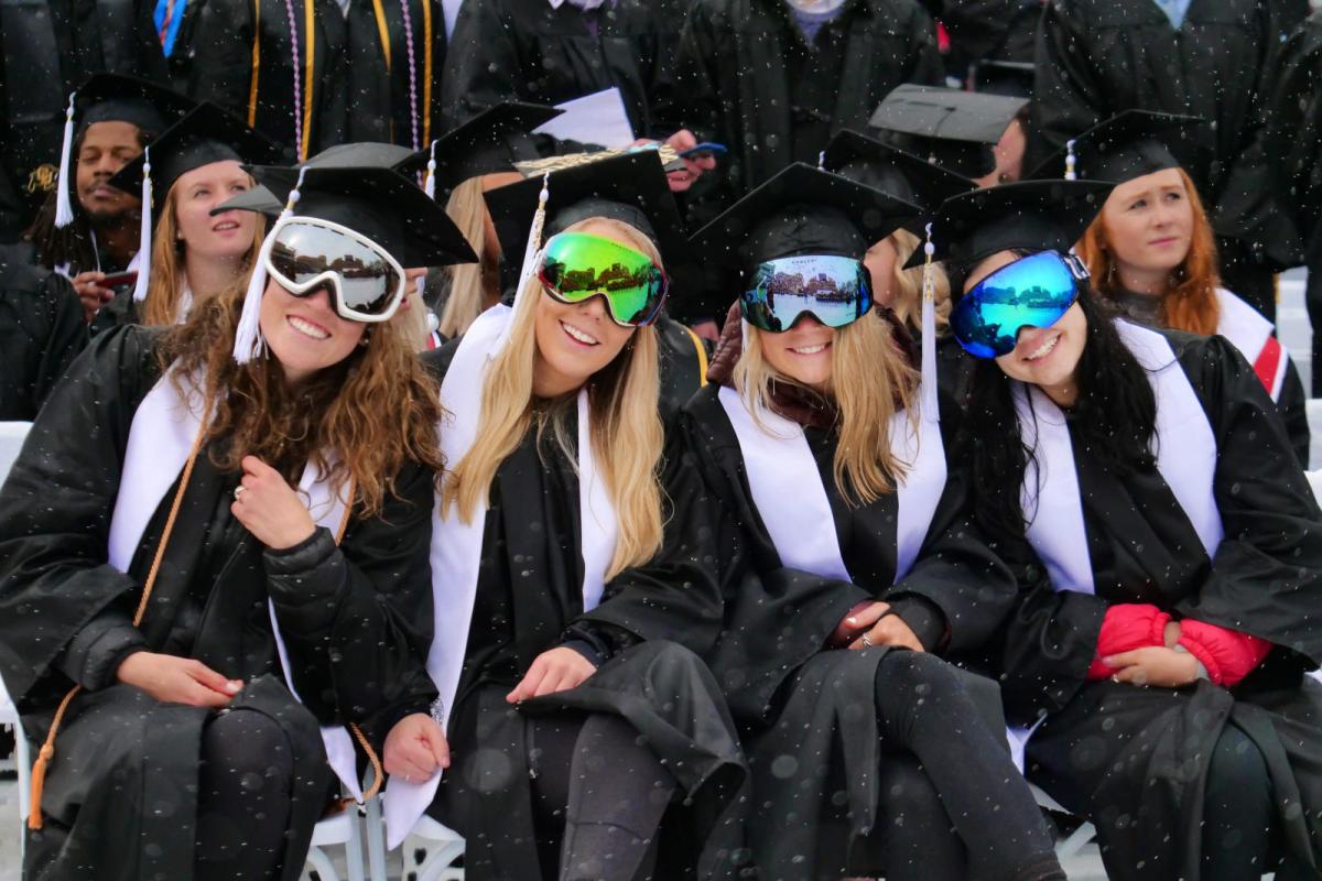 Grads at Commencement wearing ski goggles