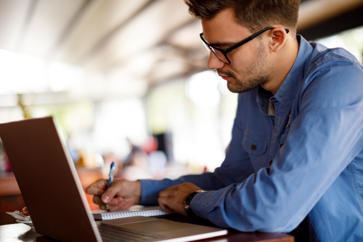 alum using job search tools on a laptop