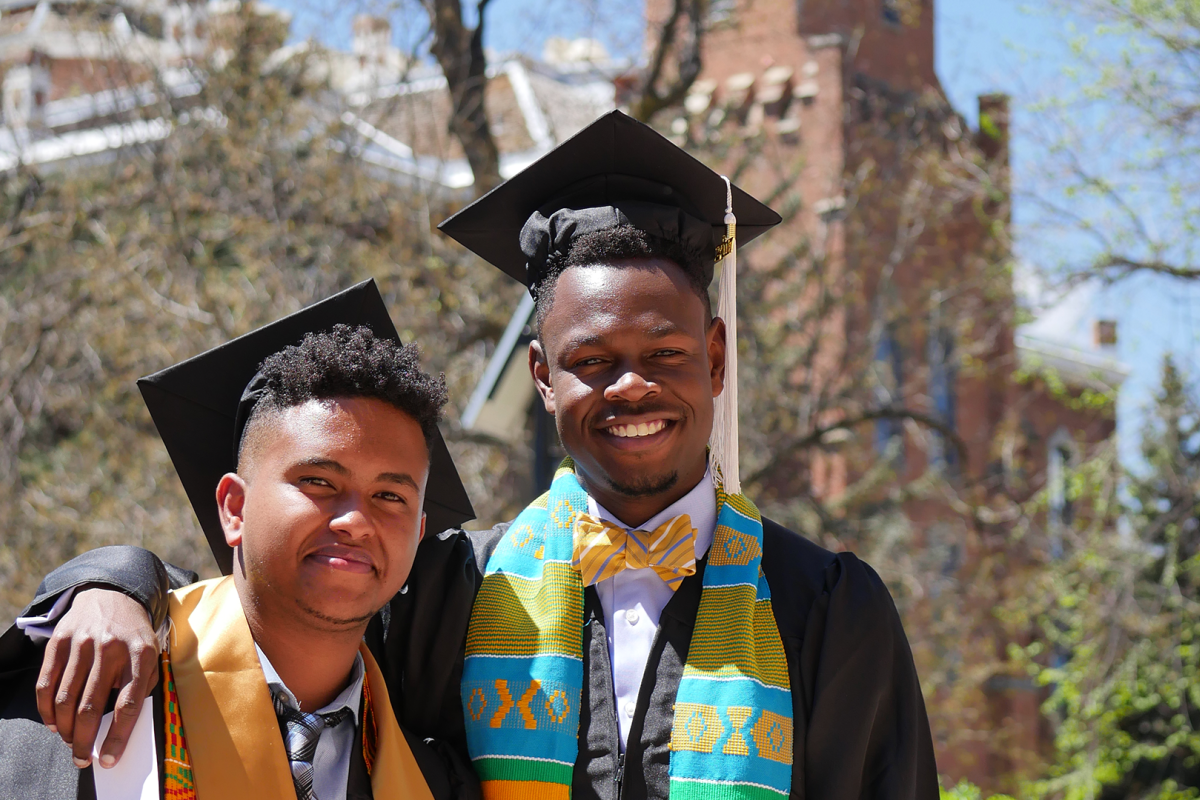 Two ForeverGold scholars in graduation regalia