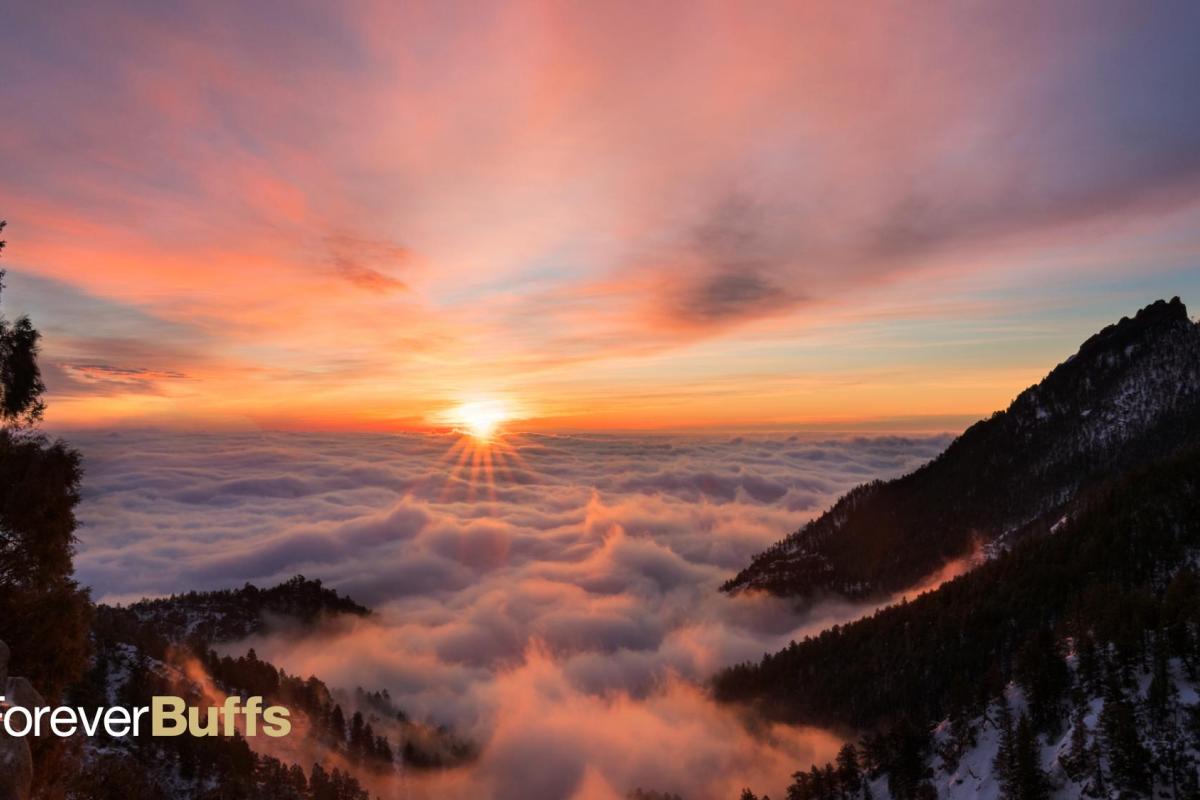 Sunrise between two mountain peaks