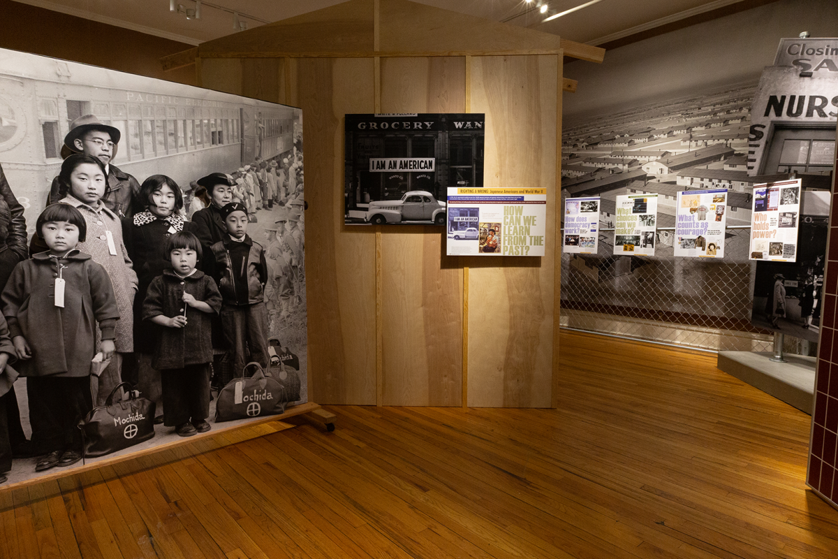 Museum panel showing WWII-era image of Japanese Americans