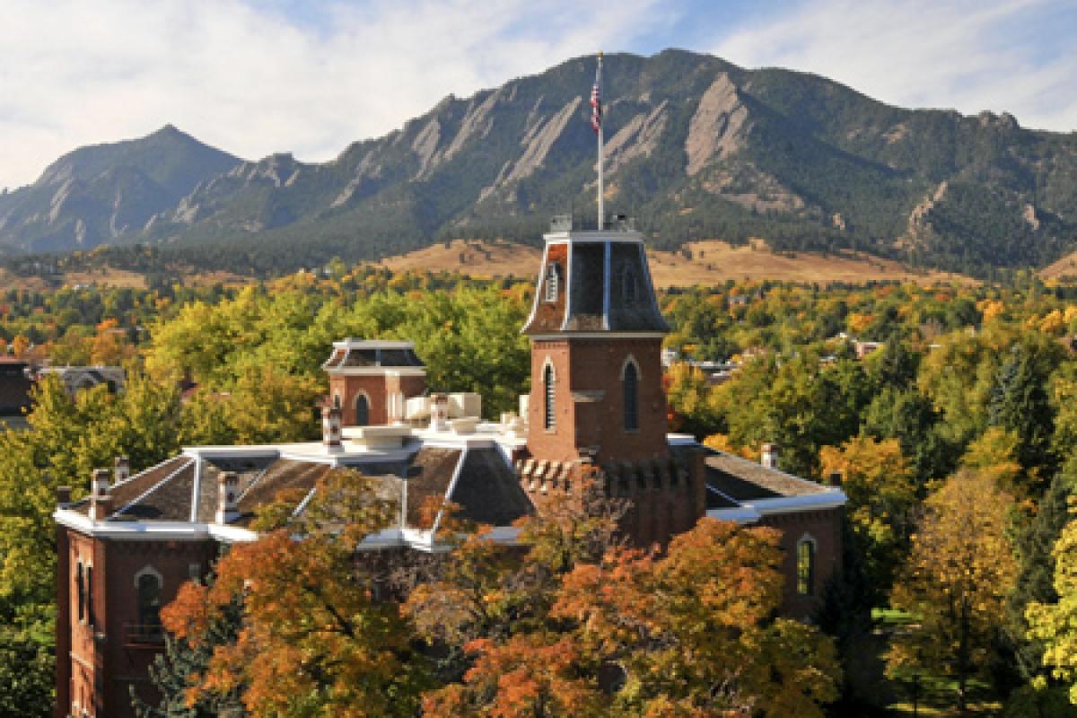 iconic cu building Old Main in front of the Flatiron mountain range
