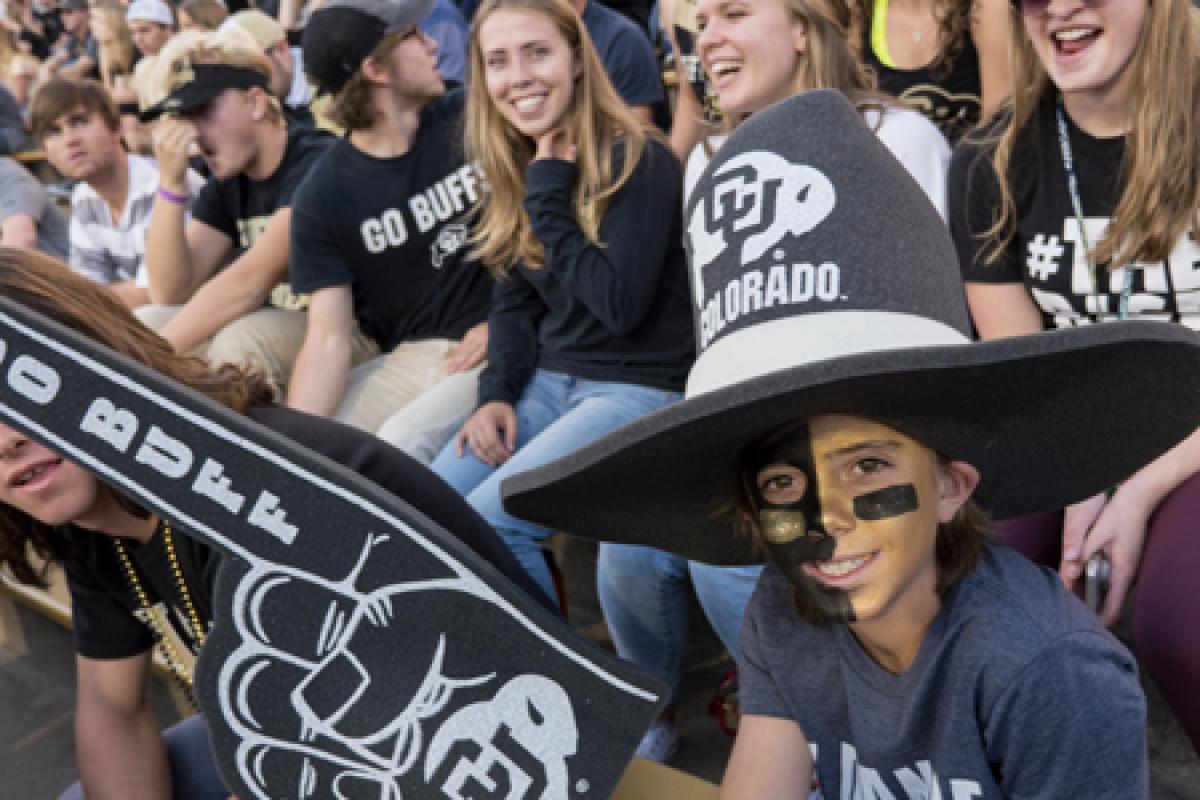 cu boulder students cheer in the stands at an athletic event