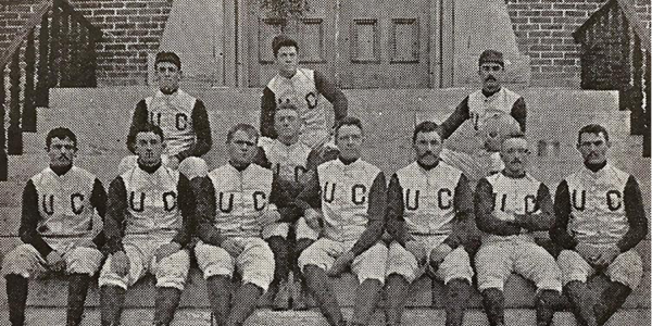 CU football team sitting on steps of Old Main