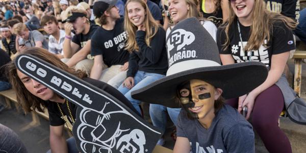 cu boulder students cheer in the stands at an athletic event