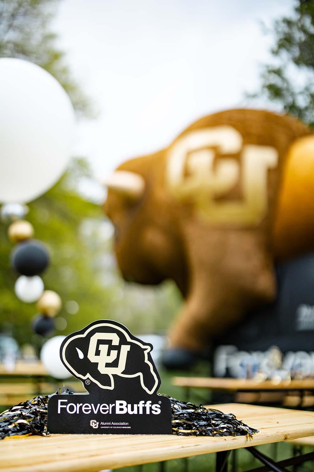 Small ForeverBuffs table topper with the large inflatable buffalo Alphie in the background