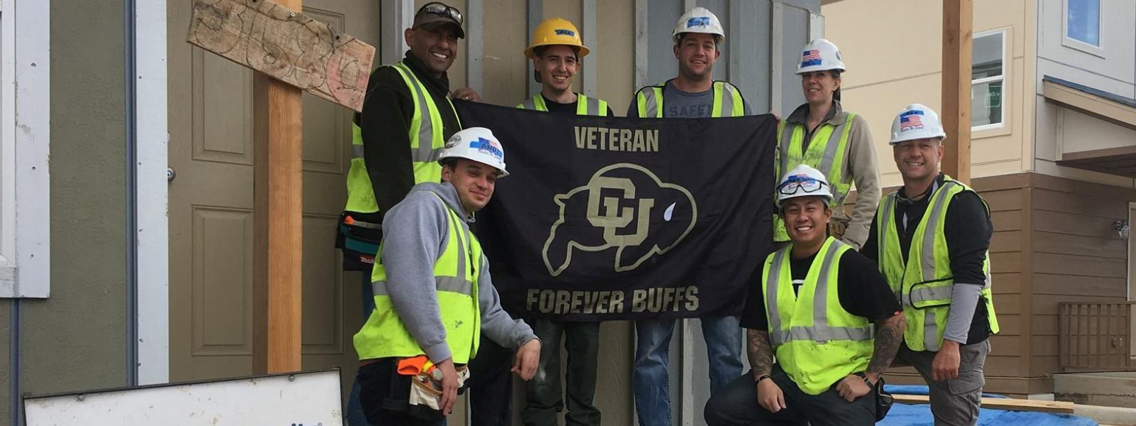 CU Veterans group and flag photo