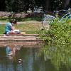 A student reading by Varsity Lake