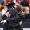 Students hugging at graduation