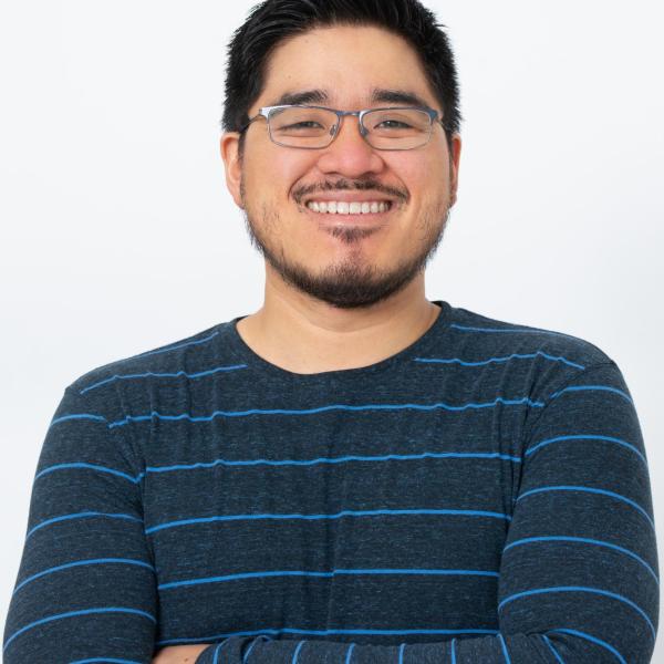 A professional style headshot of Ed Yasutake