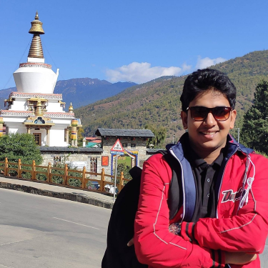 Nirab Hossain posing in front of the National Memorial Chorten in Thimphu, Bhutan