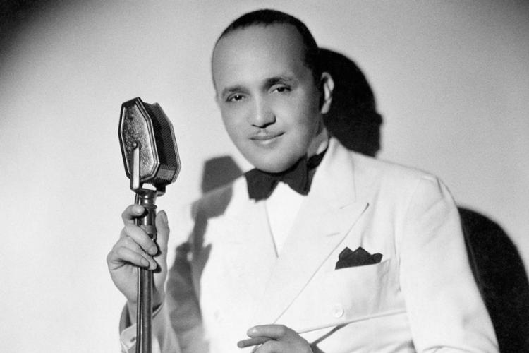 Photo of Fletcher Henderson at the microphone