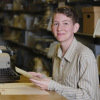 A.R. Flynn with a typewriter