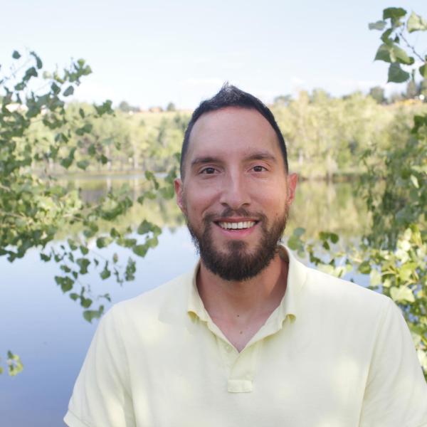 Erik in front of a pond