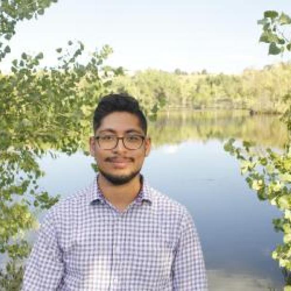 Nicholas Puente in front of a pond