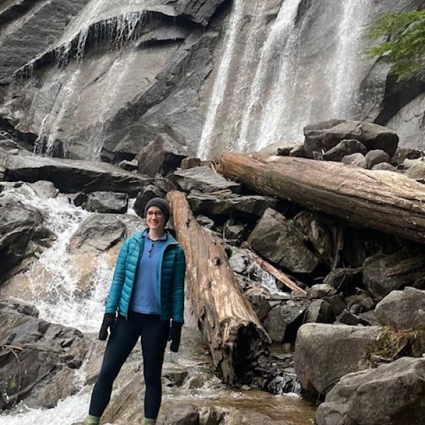 Scarlett in front of a waterfall