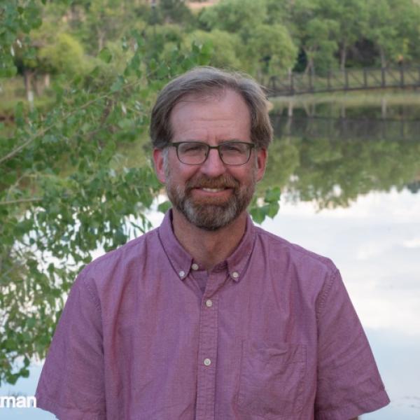 Scott Ortman in front of a pond