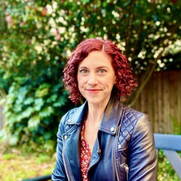 Sharon Dewitte outside on a park bench