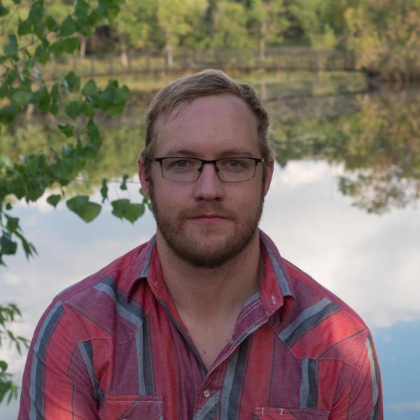 Will Taylor in front of a pond