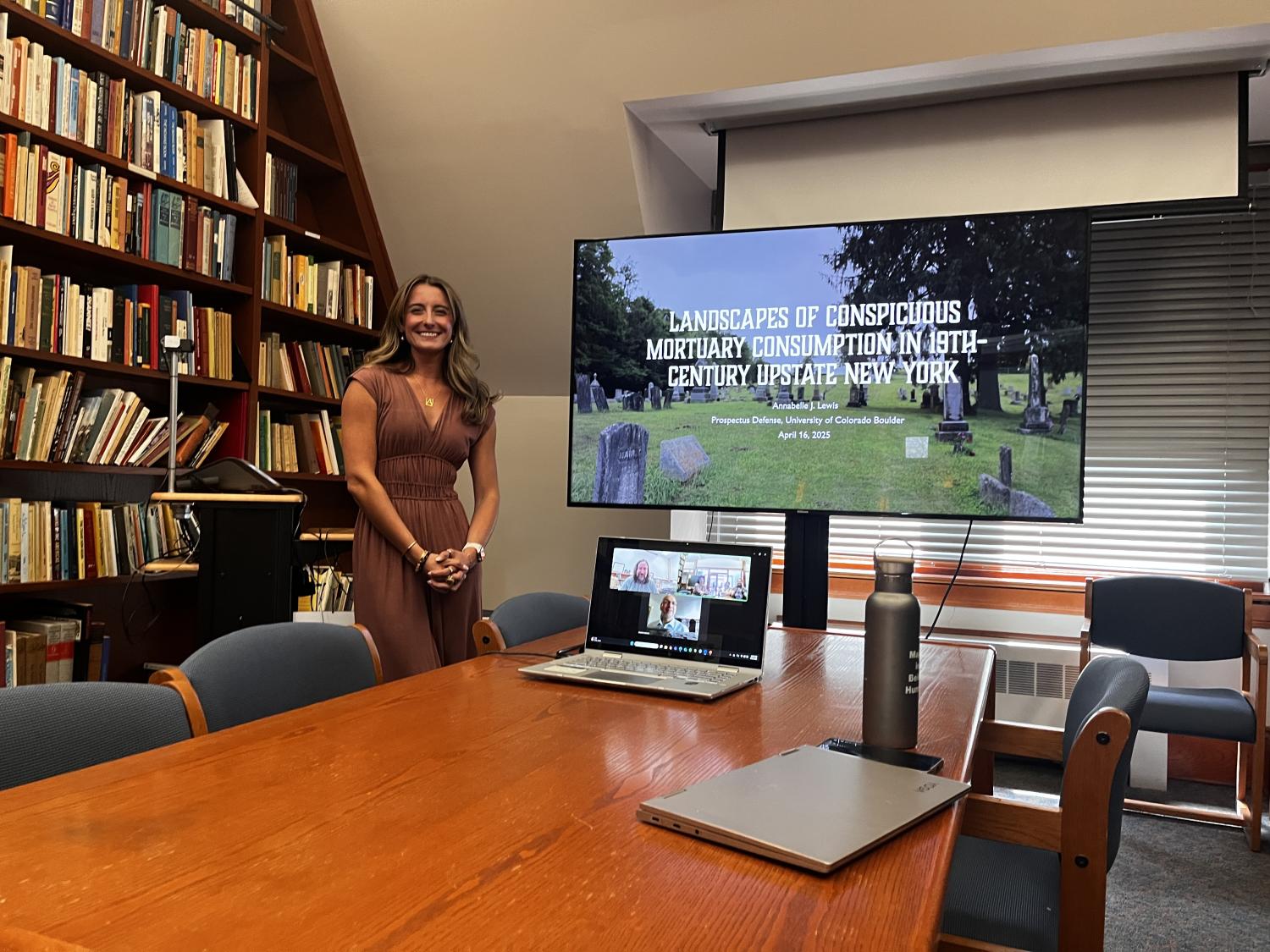 Annabelle in front of her presentation