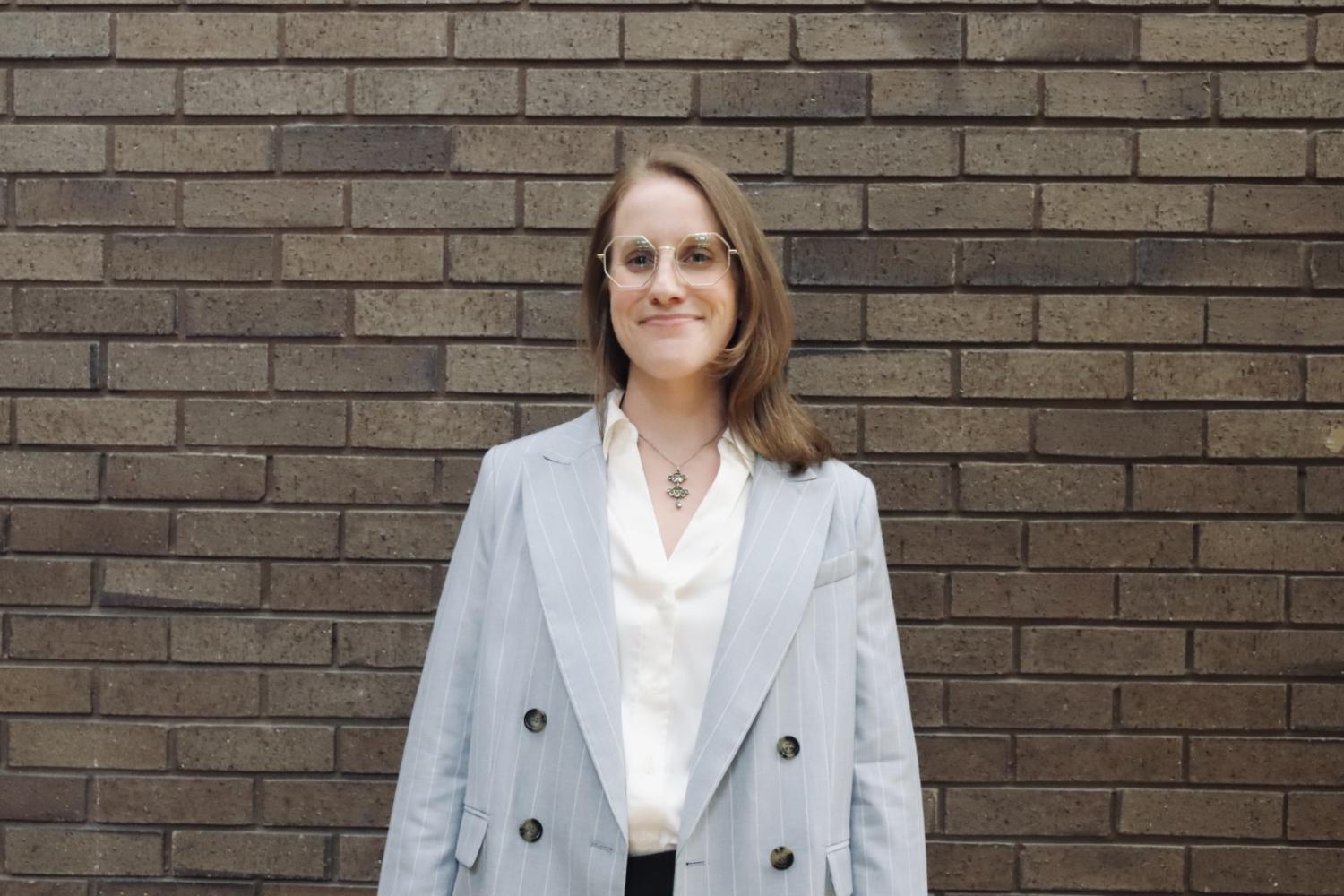 Amanda Rowe in front of a brick building