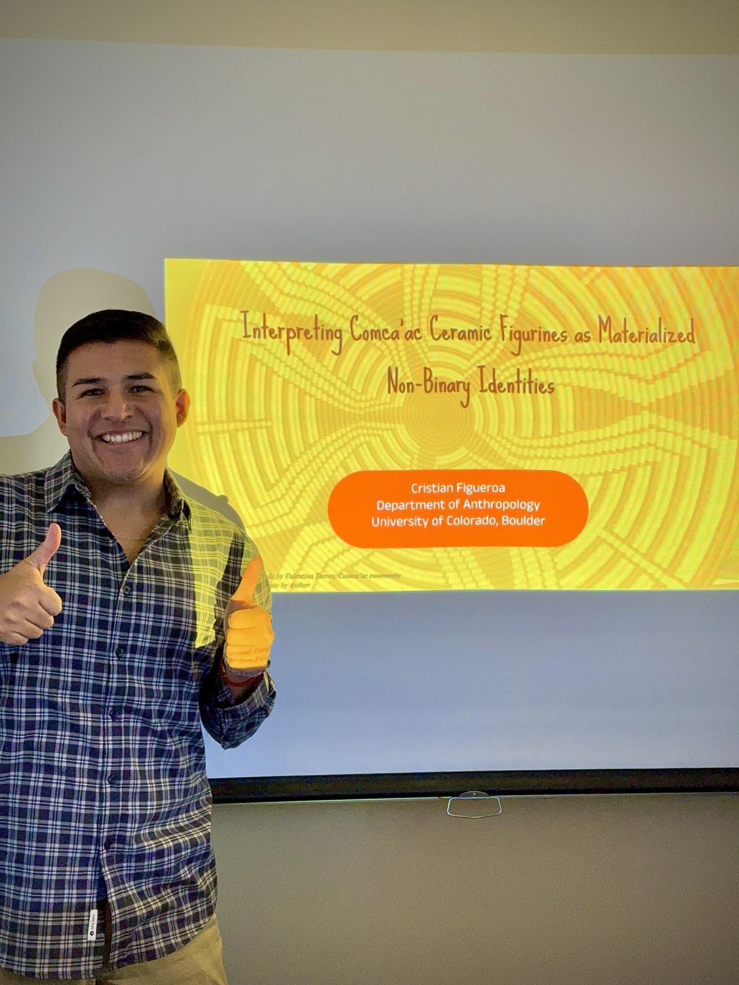 Cristian MA thesis slide with thumbs up