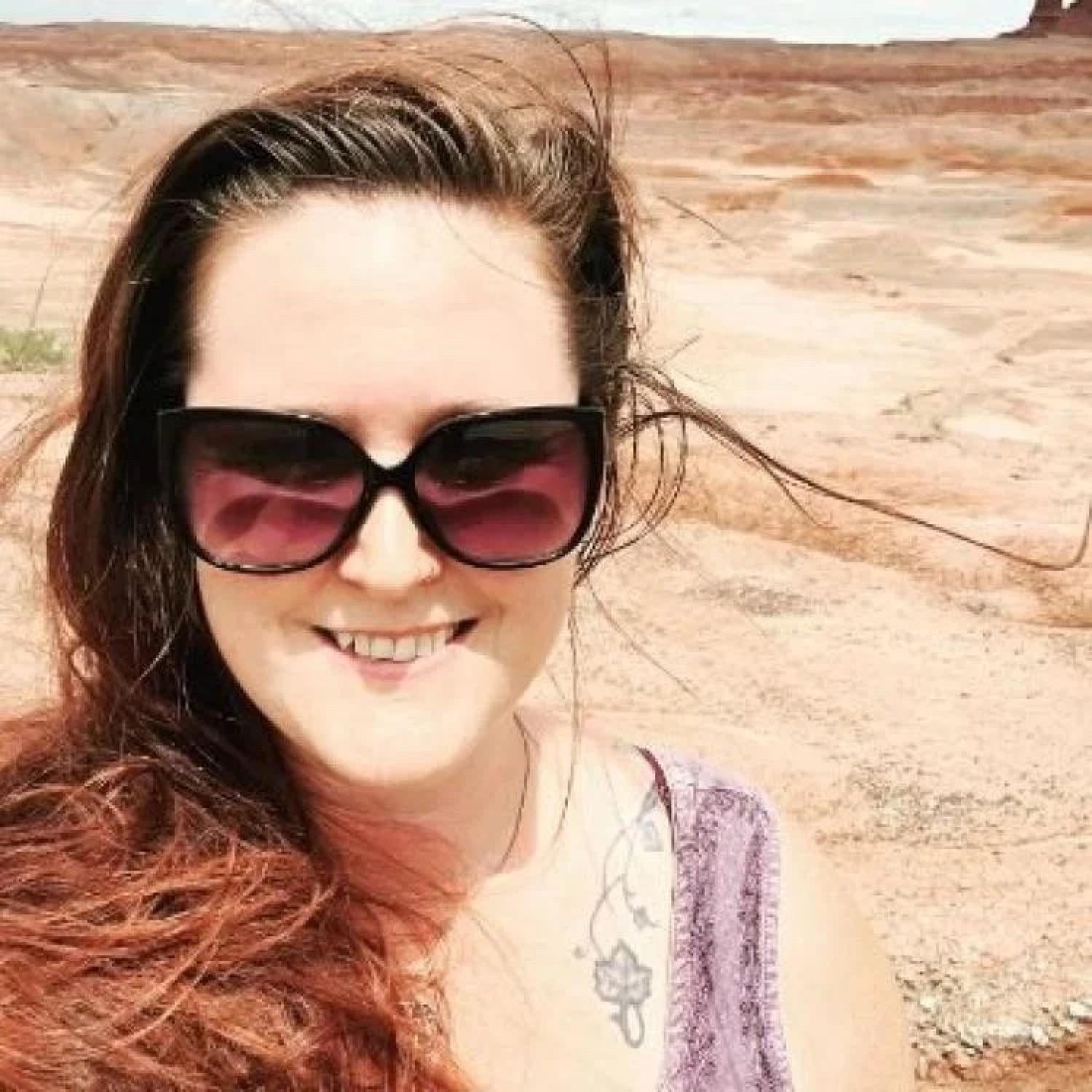 Alison Formanack wearing sunglasses in the desert