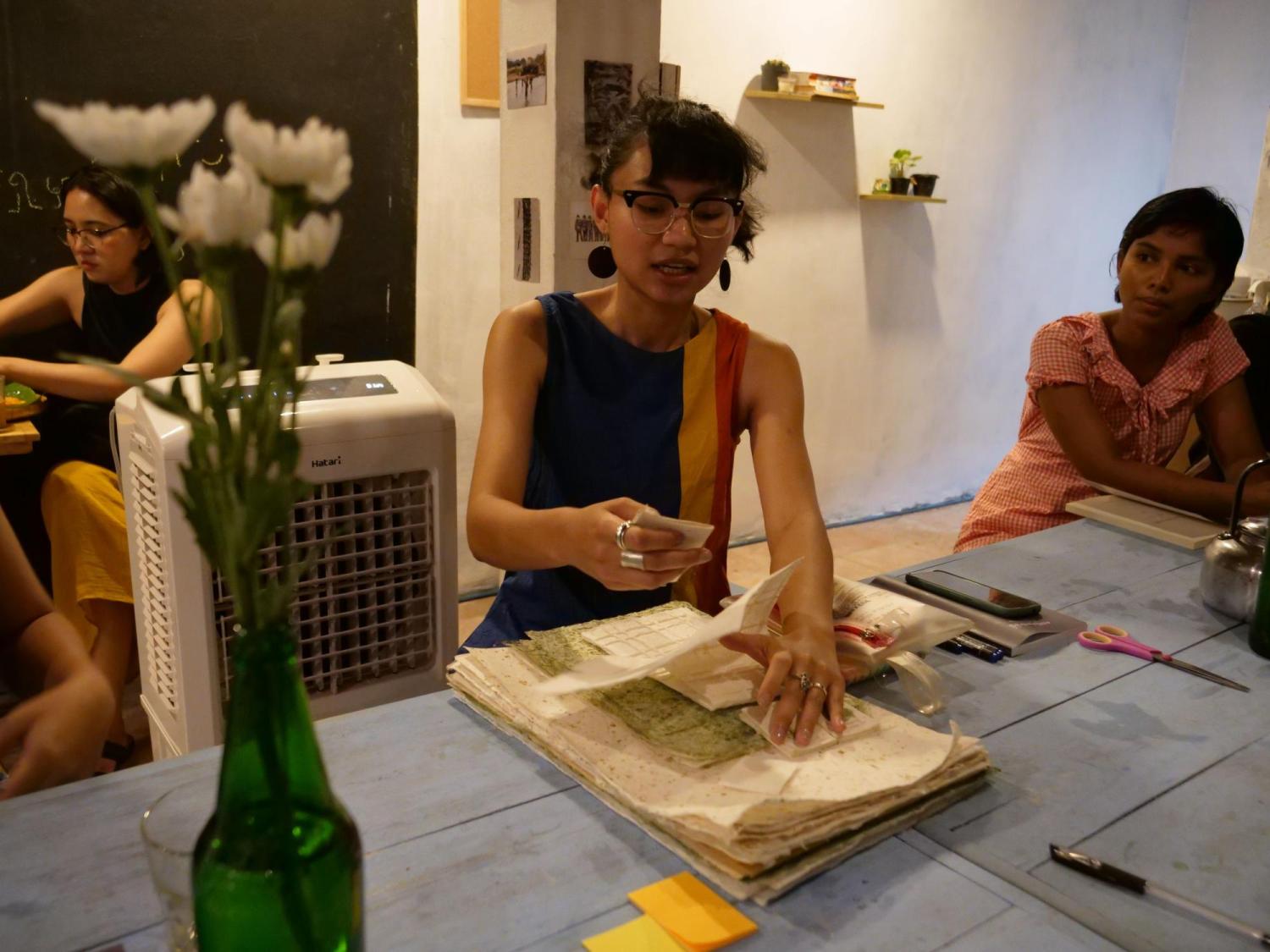 Chu Showing a Zine Magazine
