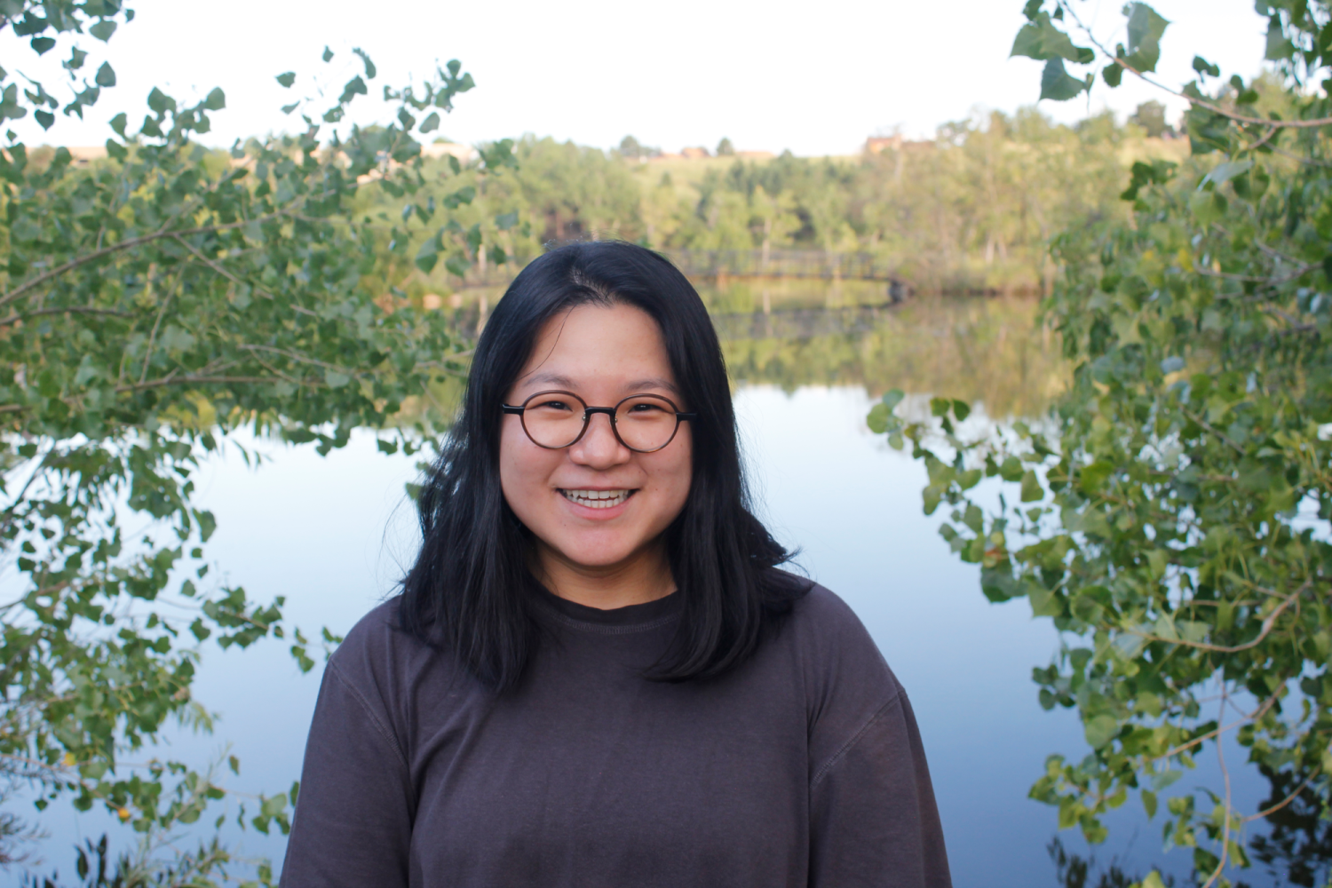 Clara in front of a pond