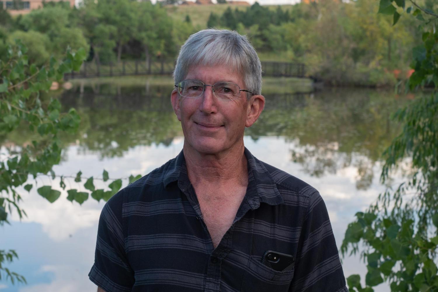 Doug in front of a pond
