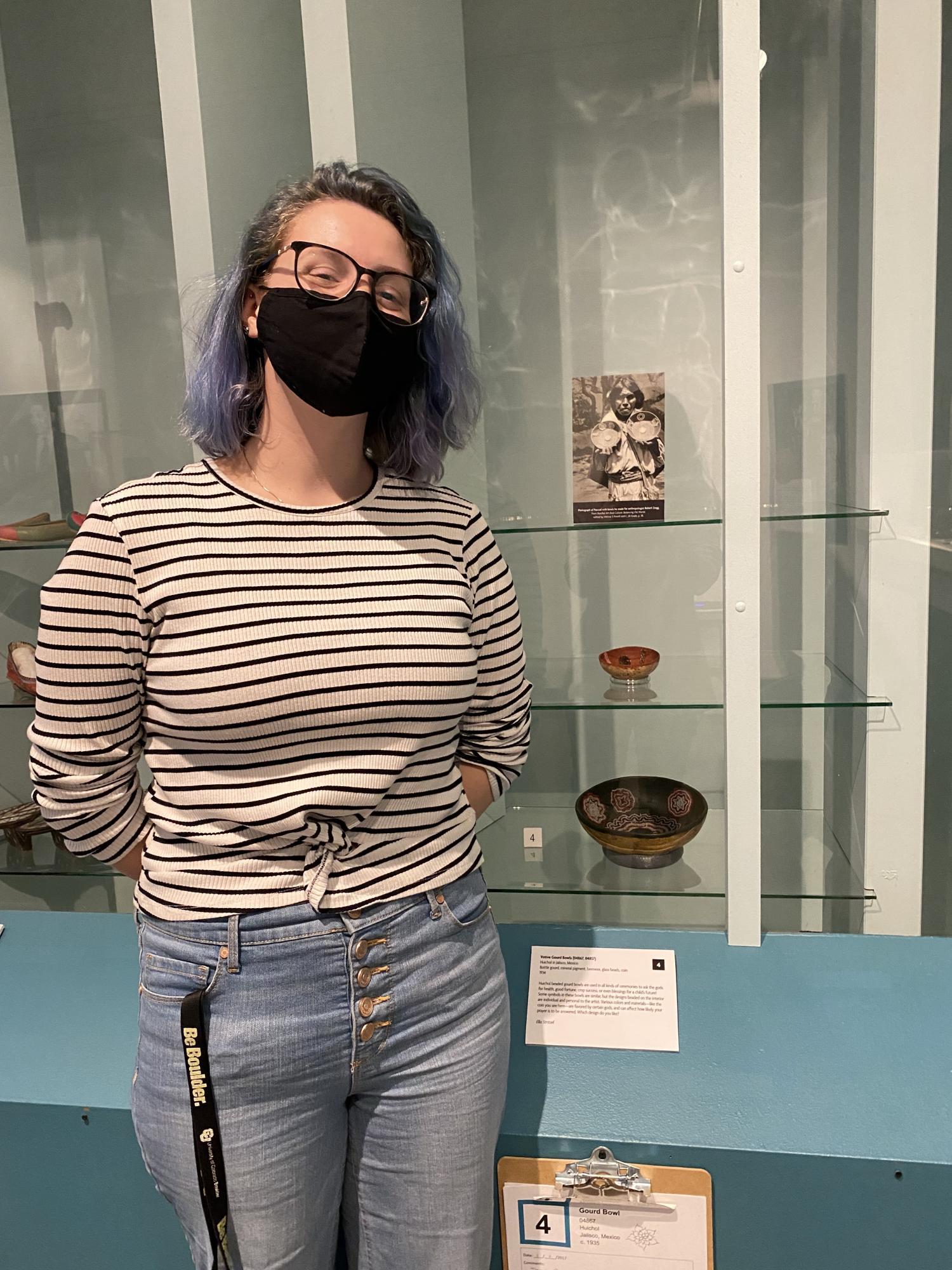 Ella Stritzel in front of a display case