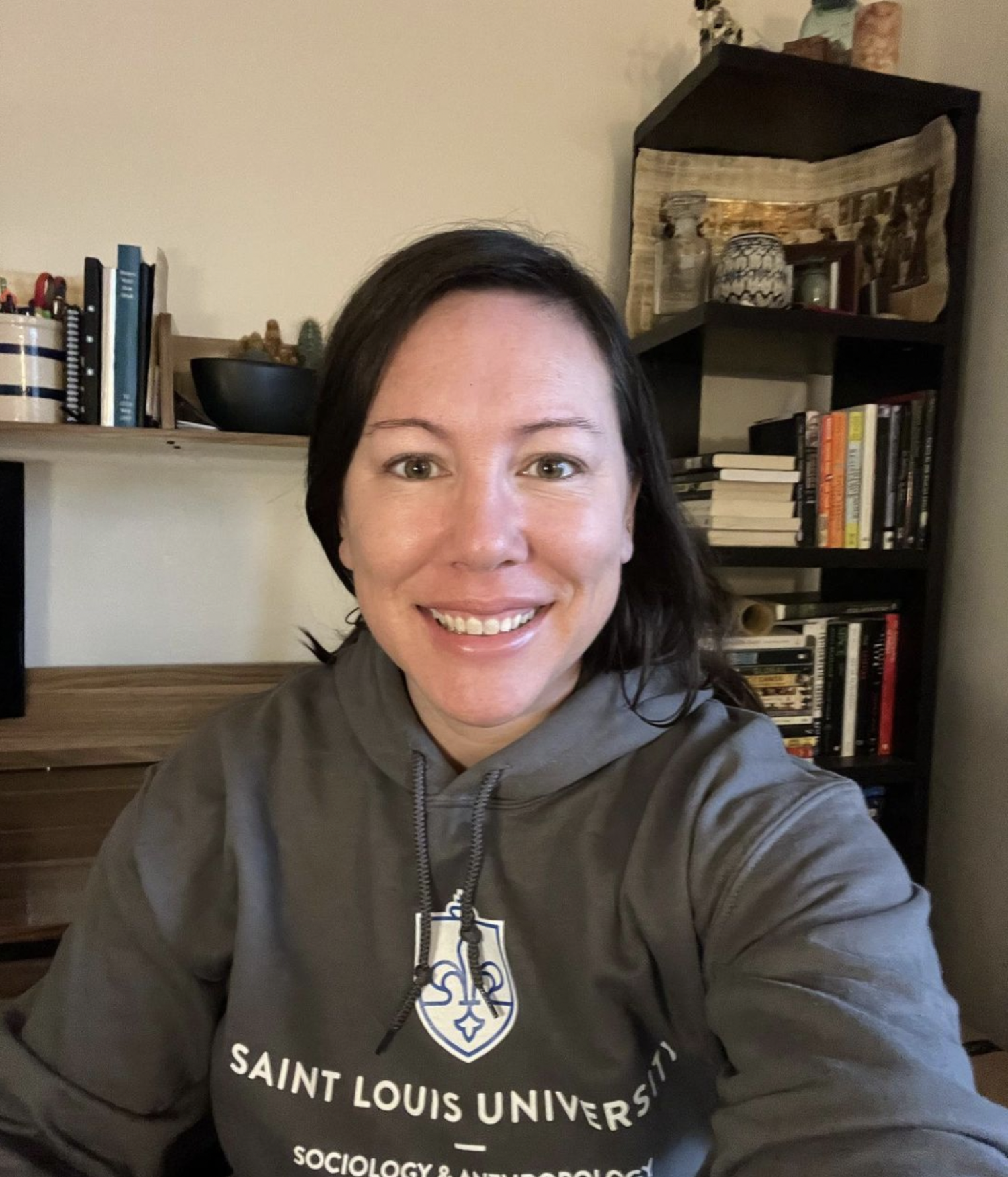 Emily Hite wearing a St. Louis University Sweatshirt