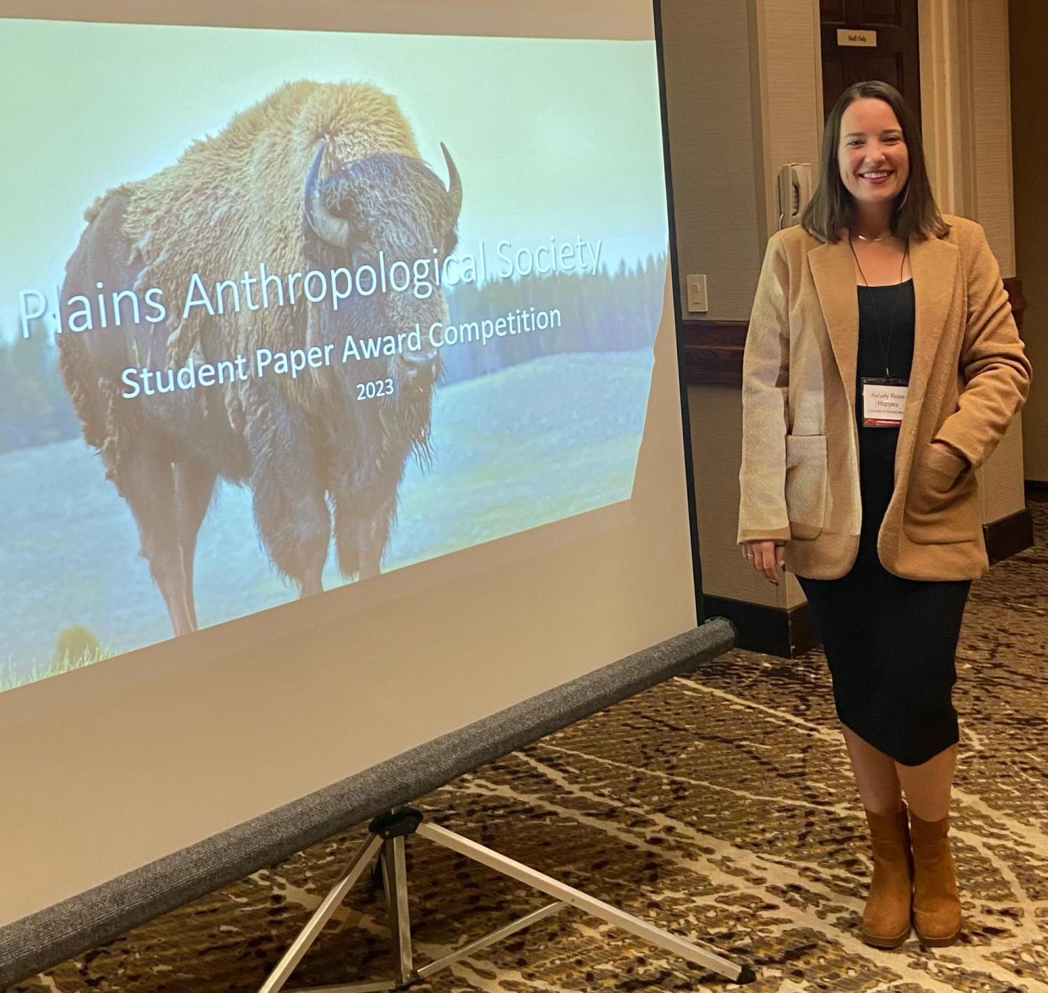 Kesley in front of her paper presentation
