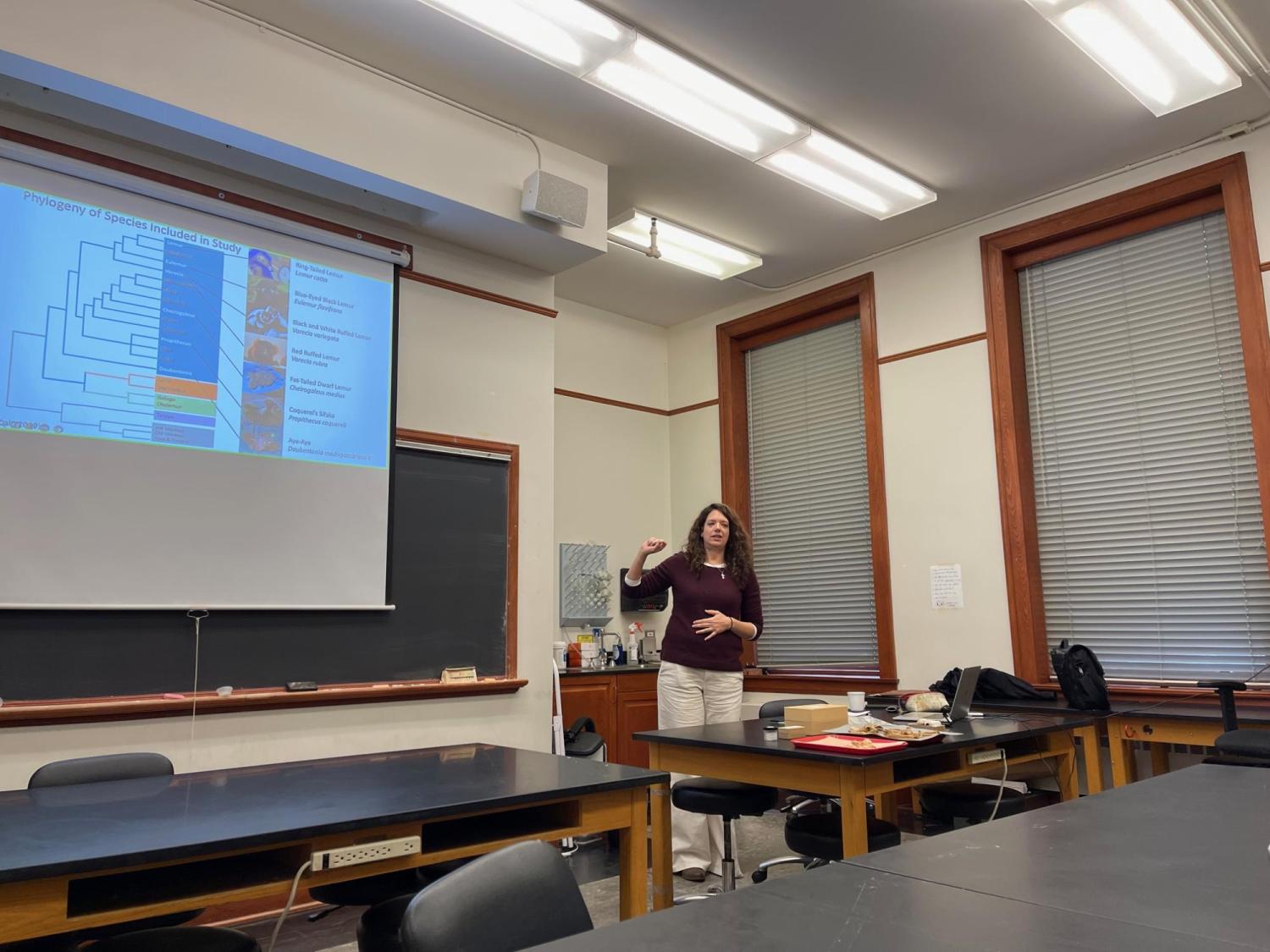 Julie Thomas in front of PowerPoint Screen