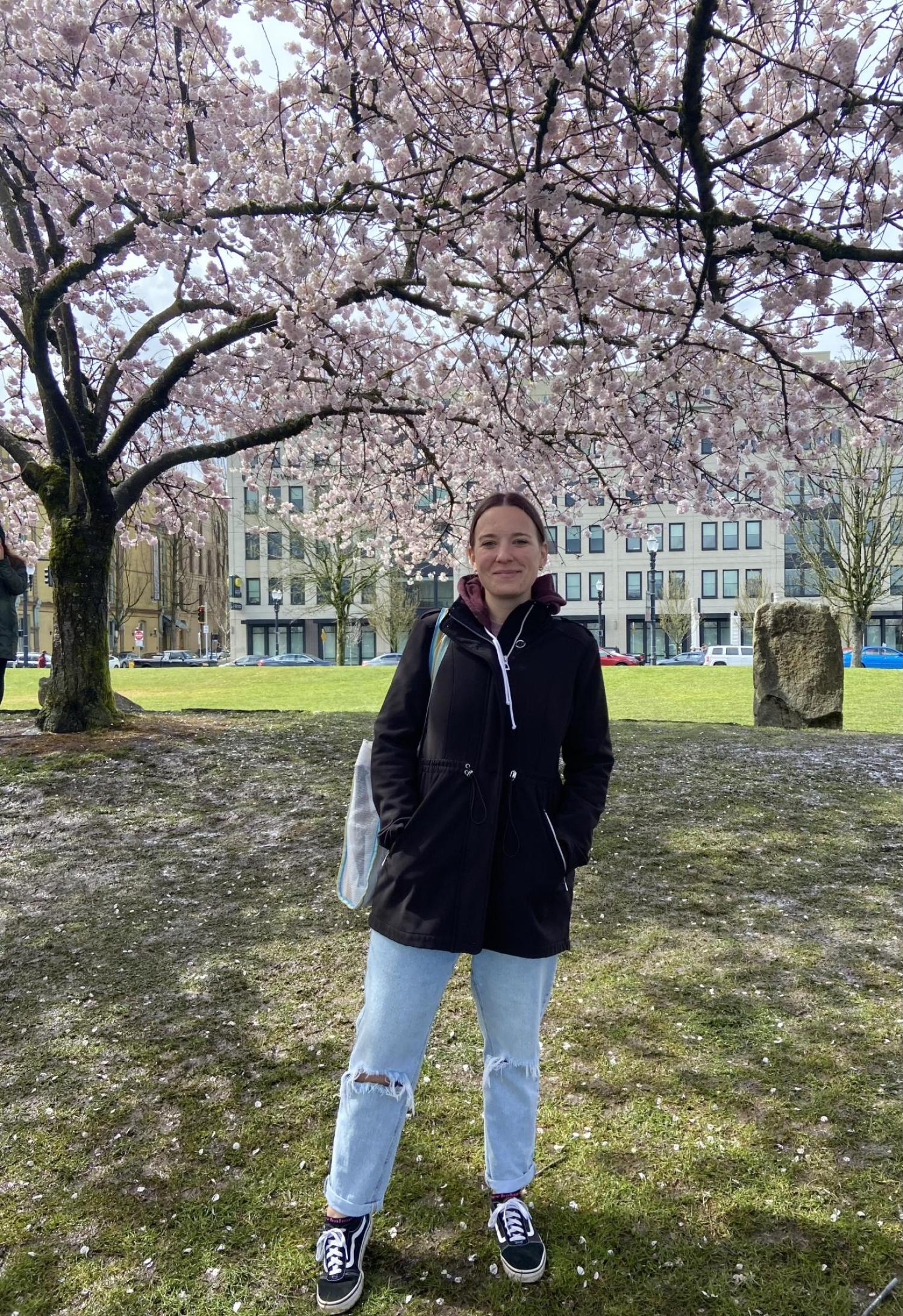 kelsey under a cherry blossom tree
