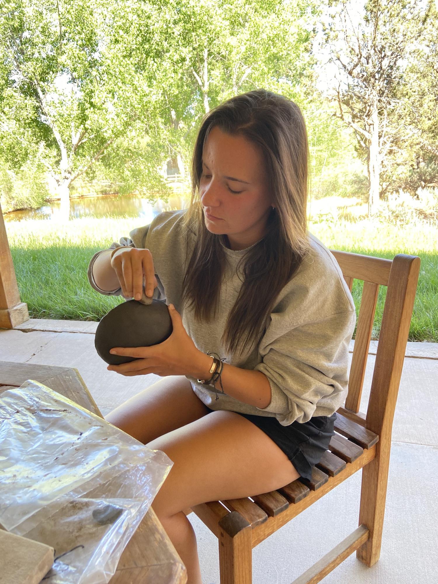 Kelsey with a ceramic bowl