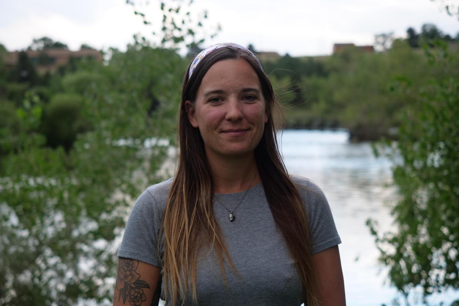 Kelsey Hoppes in front of a pond