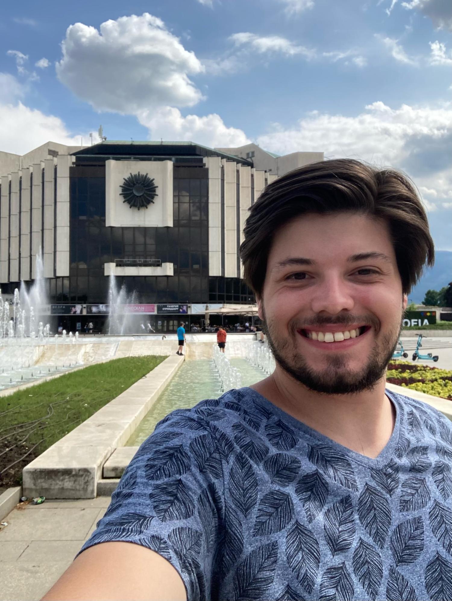 Patrick in front of a fountain