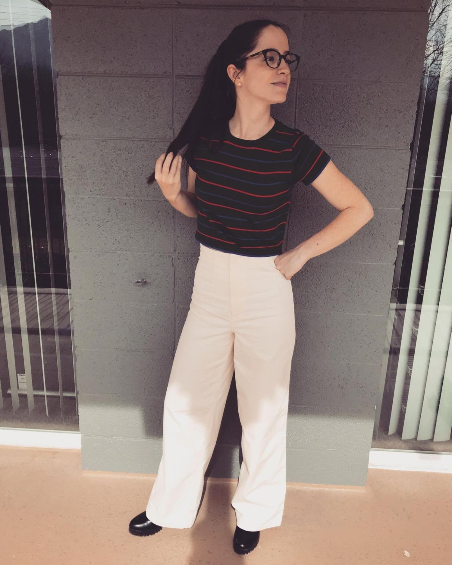 Scarlett in front of a brick wall