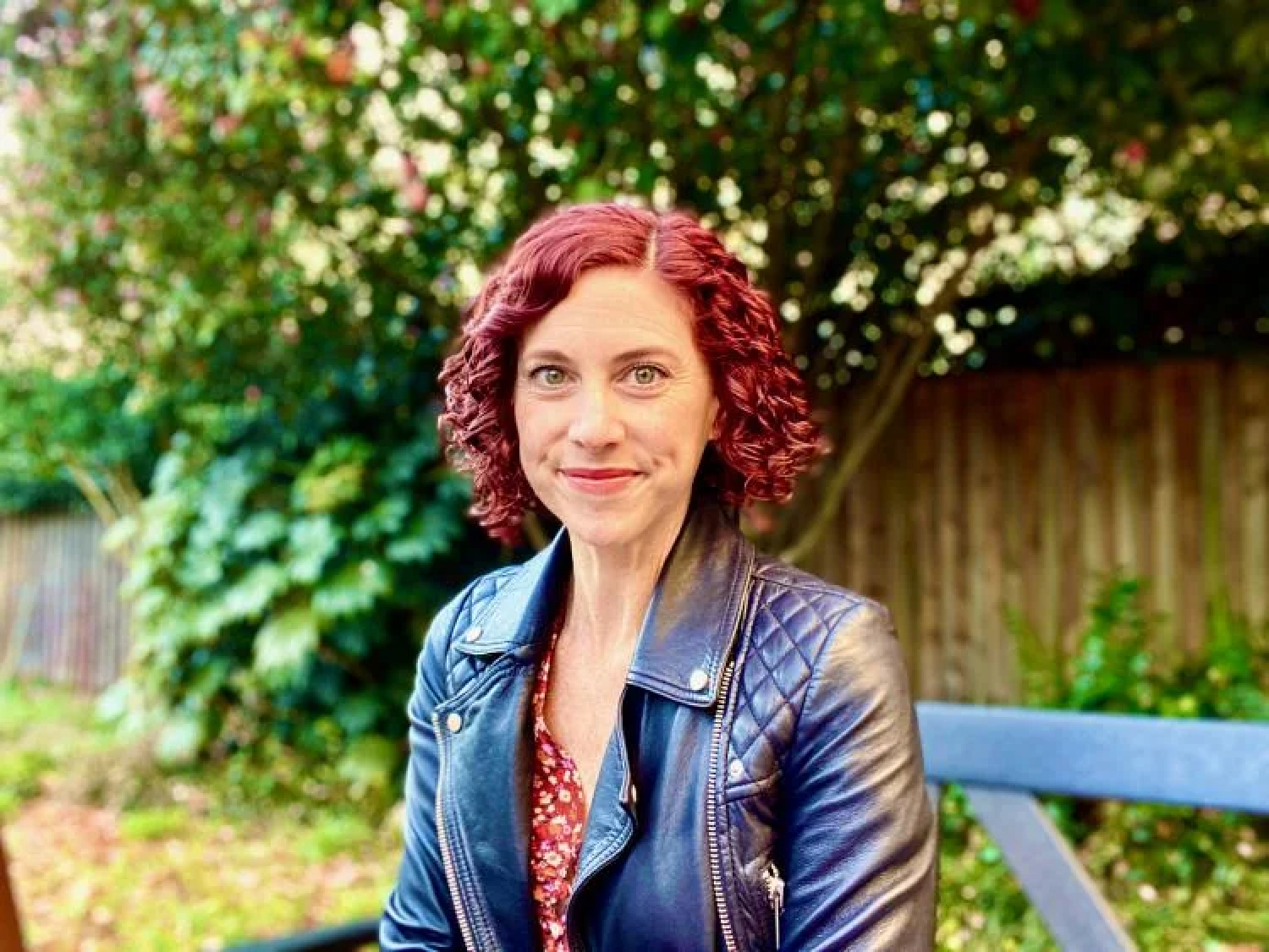 Sharon Dewitte outside on a park bench