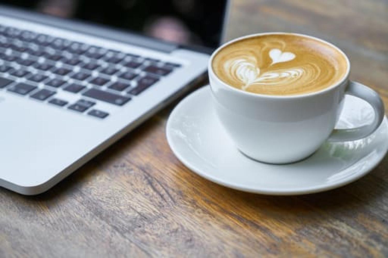 Coffee cup and computer