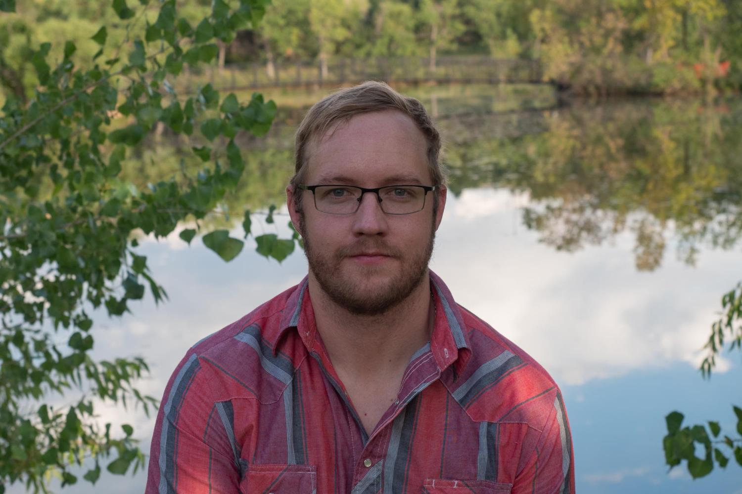 Will Taylor in front of a pond