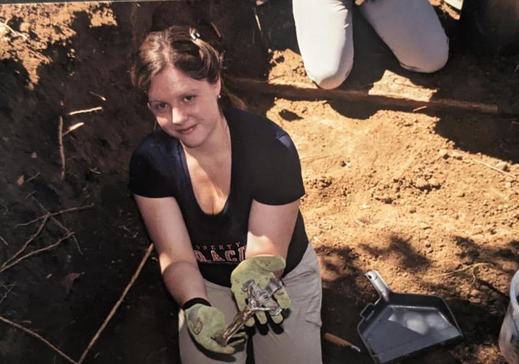 Dr. Hosek during the excavation and relocation of the Loretto Heights Cemetery in Denver (June 2022). She is holding one of the crosses affixed to the original coffins.